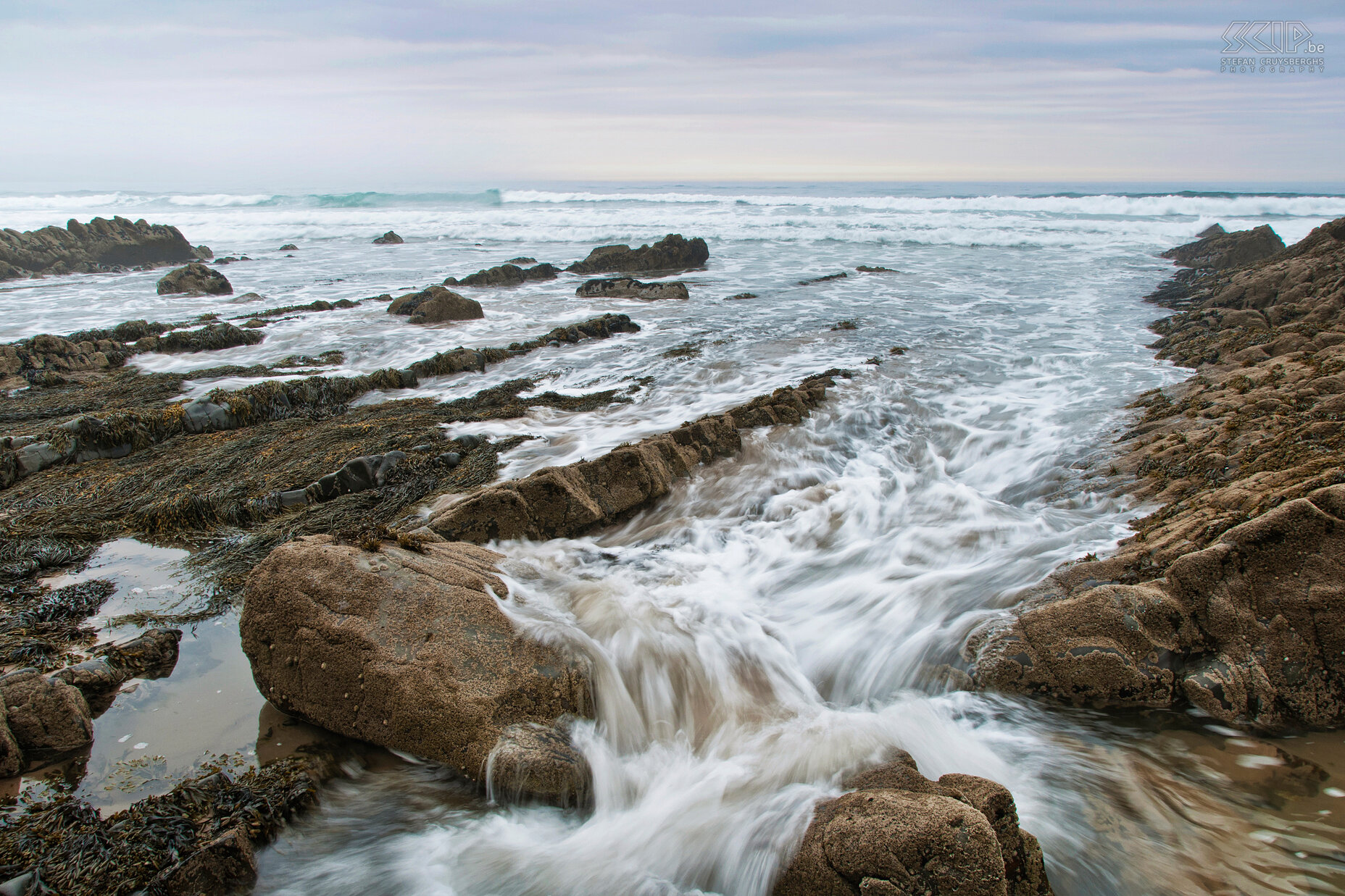 Sandymouth Beach Sandymouth Beach is covered with the most photographic  rock formations and rock pools in Cornwall. We had beautiful soft light in the evening. Stefan Cruysberghs